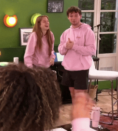 Man In Pink Hoodie Thumbs Up With Woman GIF