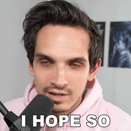 A Man In A Pink Hoodie Is Talking Into A Microphone And Says I Hope So GIF