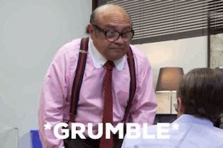 A Man In A Pink Shirt And Tie Is Standing Next To Another Man In A Blue Shirt . GIF