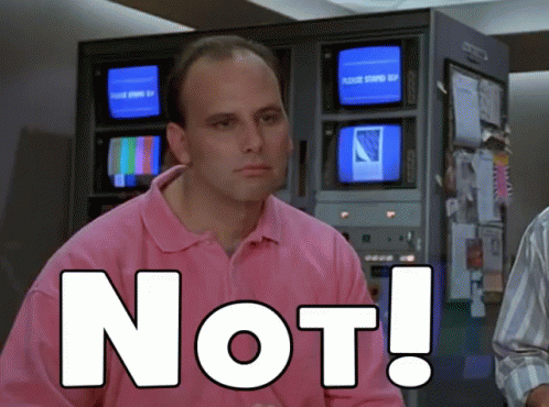A Man In A Pink Shirt Has The Word Not Written On His Chest GIF