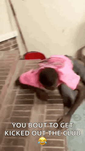 A Man In A Pink Shirt Is Laying On The Floor With A Caption That Says `` You Bout To Get Kicked Out The Club '' GIF