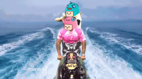 A Man In A Pink Shirt Is Riding A Jet Ski With A Cartoon Face On His Head GIF