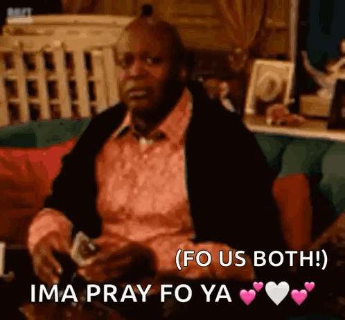 A Man In A Pink Shirt Is Sitting On A Couch Holding A Glass Of Wine And Says Ima Pray Fo Ya . GIF