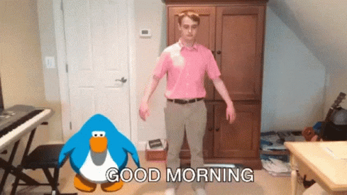 A Man In A Pink Shirt Is Standing Next To A Blue Penguin That Says " Good Morning " GIF