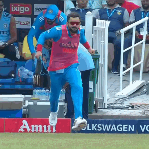 A Man In A Pink Shirt That Says Dream India GIF