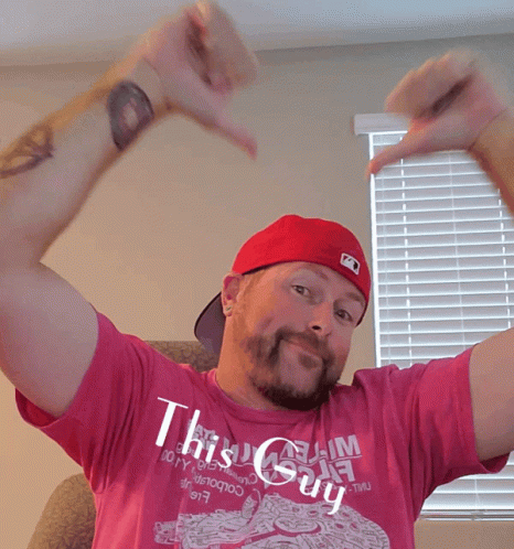 A Man In A Pink Shirt That Says This Guy GIF