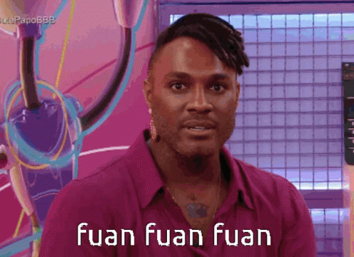 A Man In A Pink Shirt With The Words Fuan Fuan Fuan GIF