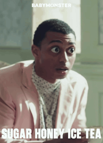A Man In A Pink Suit With The Words Sugar Honey Ice Tea Written Below Him GIF