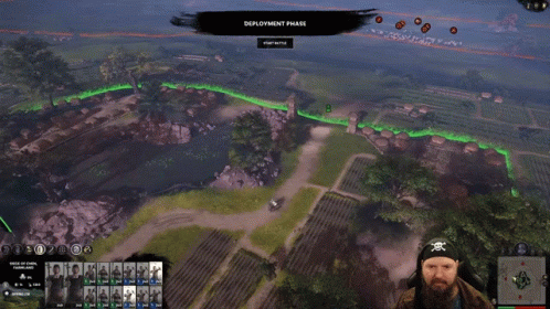 A Man In A Pirate Headband Is Playing A Video Game Called Deployment Phase GIF