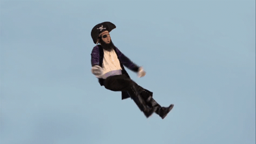 A Man In A Pirate Outfit Is Falling Through The Air GIF