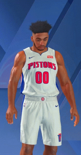 A Man In A Pistons Jersey And Shorts Stands In Front Of A Blue Background GIF