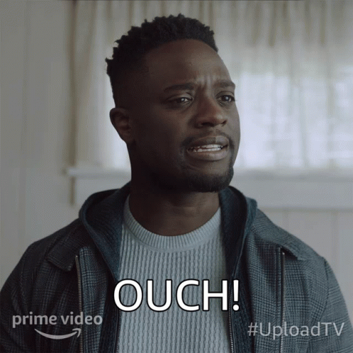 A Man In A Plaid Jacket Says Ouch In Front Of A Prime Video Logo GIF