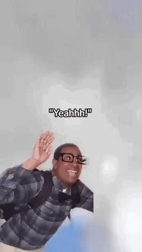 A Man In A Plaid Shirt And Glasses Is Flying Through The Air . GIF