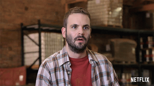 Man In Plaid Shirt With Netflix Logo GIF