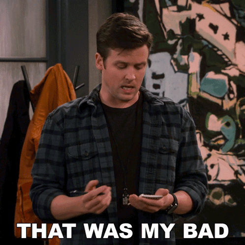 A Man In A Plaid Shirt Is Holding A Cell Phone And The Words That Was My Bad Are Behind Him GIF