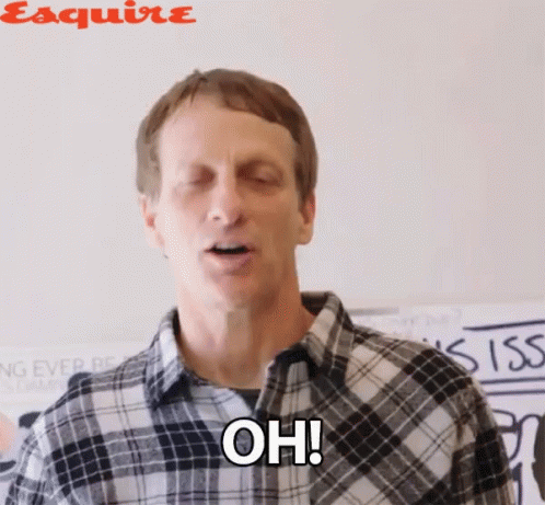 A Man In A Plaid Shirt Is Making A Funny Face And Saying Oh GIF