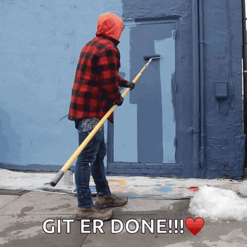 A Man In A Plaid Shirt Is Painting A Door With The Words Git Er Done GIF