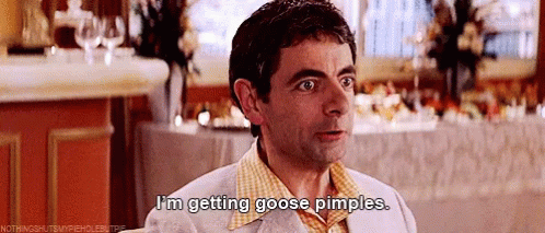 A Man In A Plaid Shirt Is Saying I 'M Getting Goose Pimples . GIF