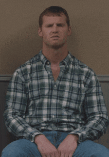 A Man In A Plaid Shirt Is Sitting Down With The Words " I Hate Change " Written Below Him GIF