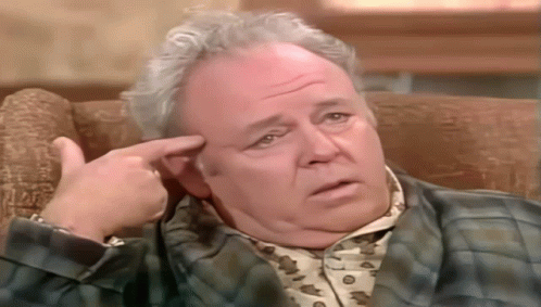 Man In Plaid Shirt Sitting On Couch GIF