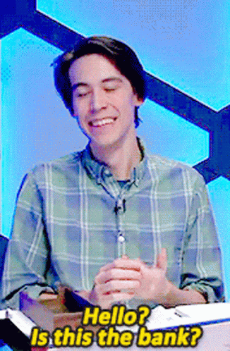 A Man In A Plaid Shirt Is Smiling And Asking " Hello " GIF