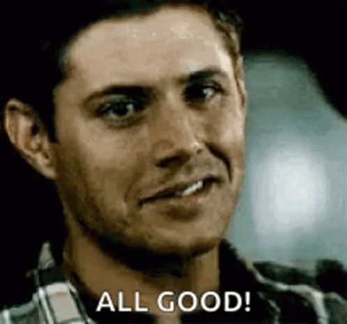 A Man In A Plaid Shirt Is Smiling And Saying All Good . GIF