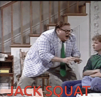 A Man In A Plaid Shirt Is Squatting In Front Of A Boy In A Green Shirt Who Is Sitting On A Couch GIF