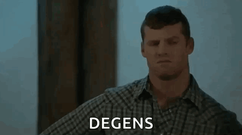 A Man In A Plaid Shirt Is Standing In Front Of A Sign That Says " Degens " GIF
