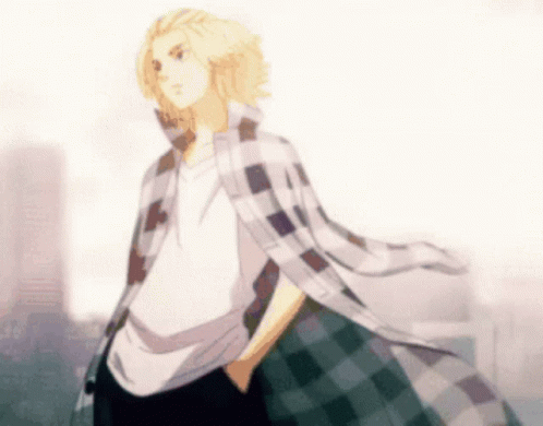A Man In A Plaid Shirt Is Standing With His Hands In His Pockets In Front Of A City . GIF