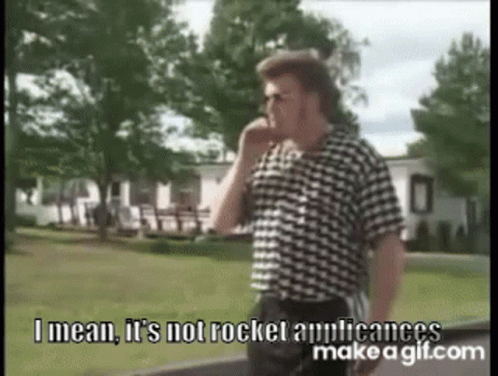 A Man In A Plaid Shirt Is Talking On A Cell Phone . GIF