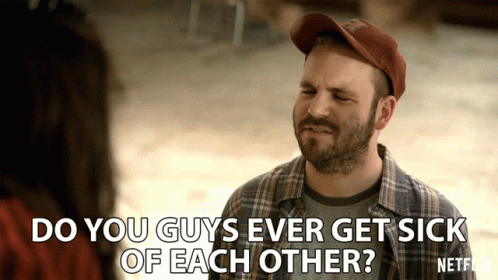 Man In Plaid Shirt Talking To Woman GIF