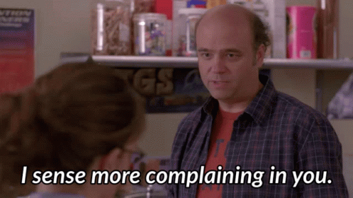 A Man In A Plaid Shirt Is Talking To A Woman Who Says I Sense More Complaining In You GIF