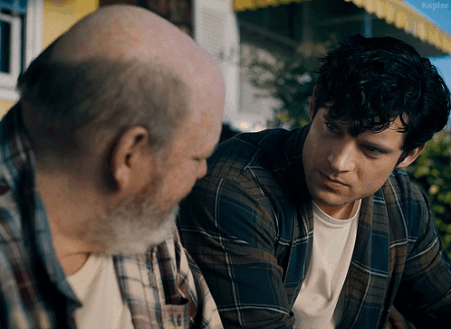 A Man In A Plaid Shirt Is Talking To An Older Man With The Word Kepler Visible In The Corner GIF