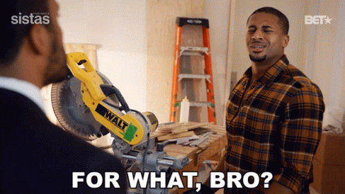 A Man In A Plaid Shirt Is Talking To Another Man In Front Of A Walt Saw GIF