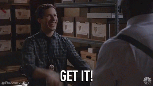 A Man In A Plaid Shirt Says Get It In A Warehouse GIF