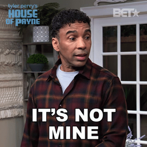 A Man In A Plaid Shirt Says It 'S Not Mine In Front Of A Window GIF