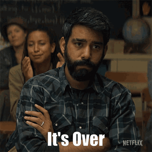 A Man In A Plaid Shirt Says " It 'S Over " In Front Of A Group Of People GIF