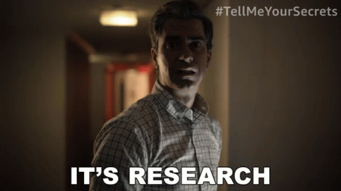 A Man In A Plaid Shirt Says It 'S Research In A Hallway GIF