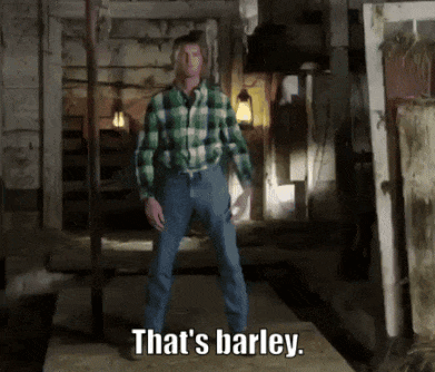 A Man In A Plaid Shirt Says That 'S Barley In A Dark Room GIF