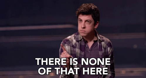 A Man In A Plaid Shirt Says There Is None Of That Here In A Dark Room . GIF