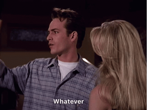 A Man In A Plaid Shirt Says Whatever While Standing Next To A Blonde Woman GIF