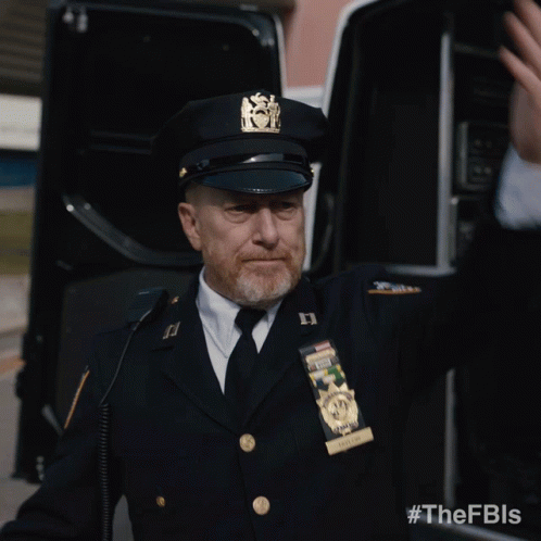 A Man In A Police Uniform Has A Badge That Says New York State Police GIF