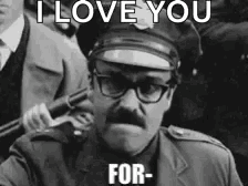 A Man In A Police Uniform Is Holding A Gun And Says I Love You For GIF
