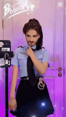 A Man In A Police Uniform Is Standing In Front Of A Purple Door GIF
