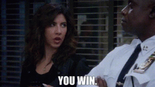 A Man In A Police Uniform Is Talking To A Woman Who Is Holding A Cell Phone . GIF