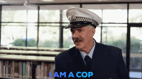 A Man In A Police Uniform Says I Am A Cop In Blue GIF