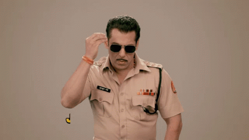 A Man In A Police Uniform Says " Jwala Hai Jwala " In Yellow Letters GIF