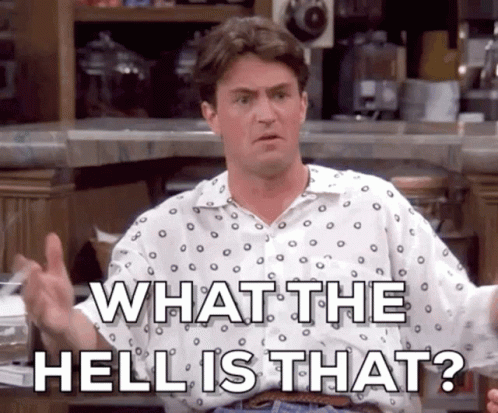 A Man In A Polka Dot Shirt Is Giving A Thumbs Up And Says What The Hell Is That ? GIF