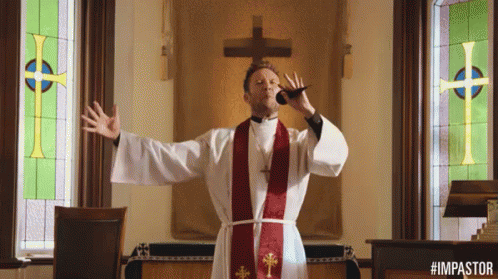 A Man In A Priest 'S Robe Is Blowing A Horn In Front Of A Cross GIF