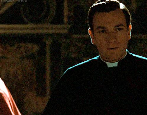 A Man In A Priest 'S Uniform Is Standing In A Dark Room With A Watermark That Says Arkvgfs Tumblr GIF